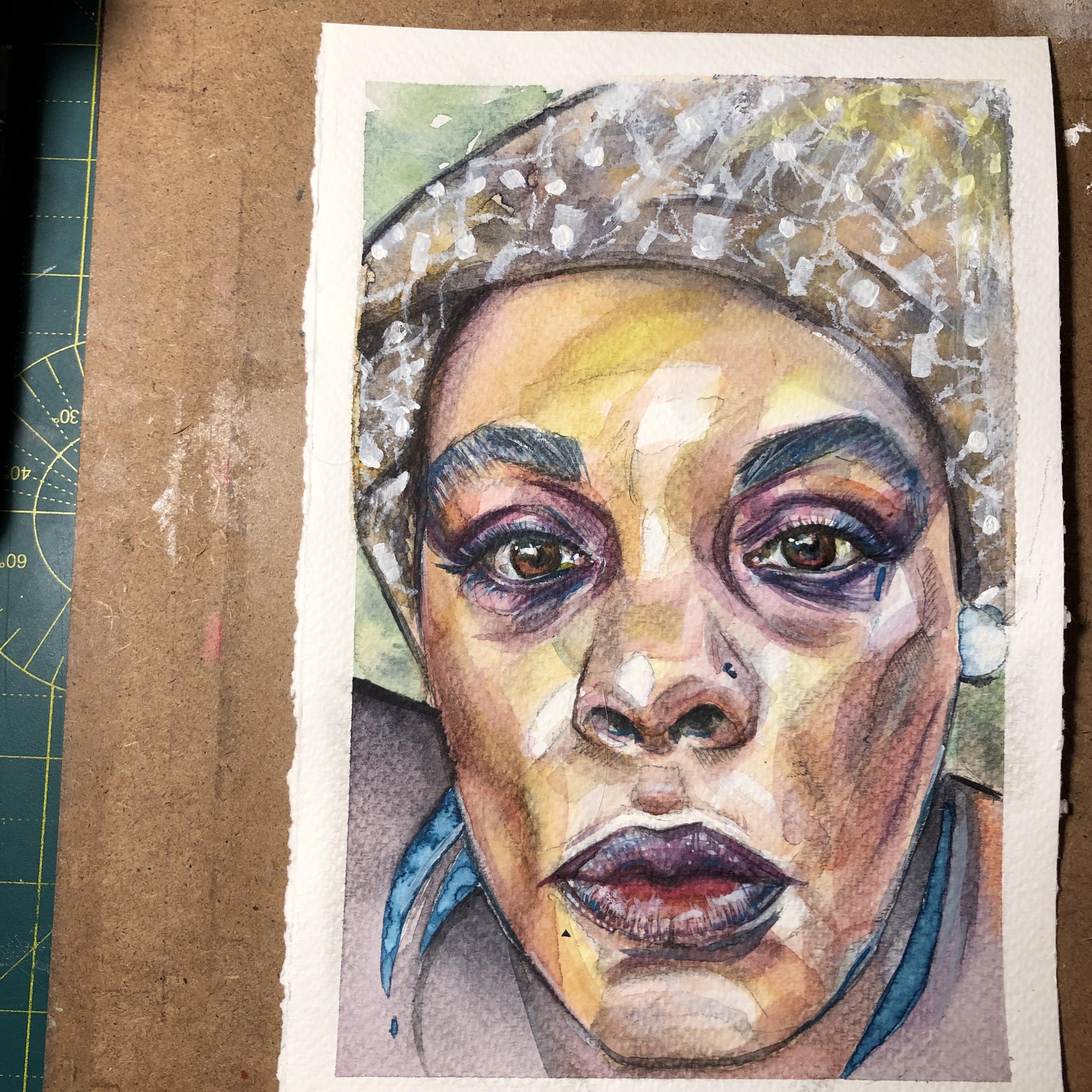 A colorful watercolor portrait on a white a5.
A young woman is looking directly at you.