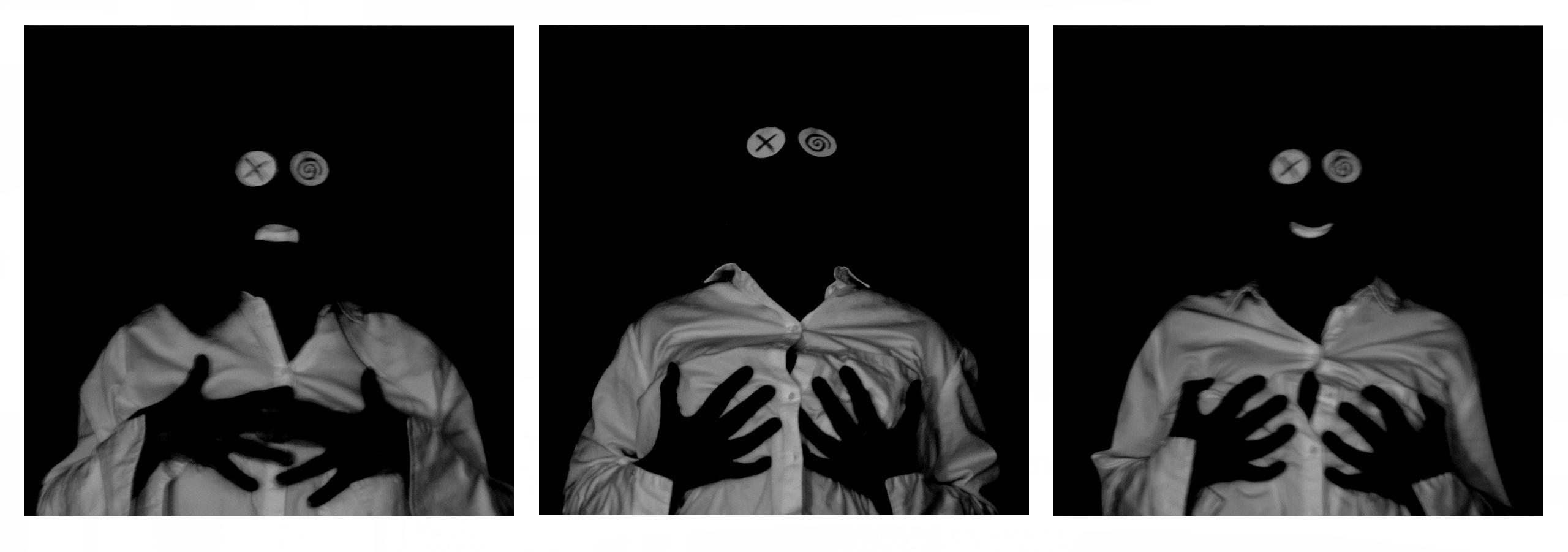 Three black square pictures in a row on a white background. The pictures show a white shirt, two round white cardboard eyes on each image. The eye to the left has a drawn cross on it and the one to the right, a spiral. The left picture also shows a small white mouth that makes the figure look a little confused, and the image to the right a happy mouth. The picture in the middle has no mouth at all. In the left picture, two black hands are held over the breasts, in the middle one they are held on the breasts, and in the right picture they are grabbing the breasts. All three pictures are made directly in-camera, but cropped as squares and placed upon the white background afterwards, to sit together in a row.