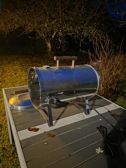 A Murrikka smoke oven on a metal table.