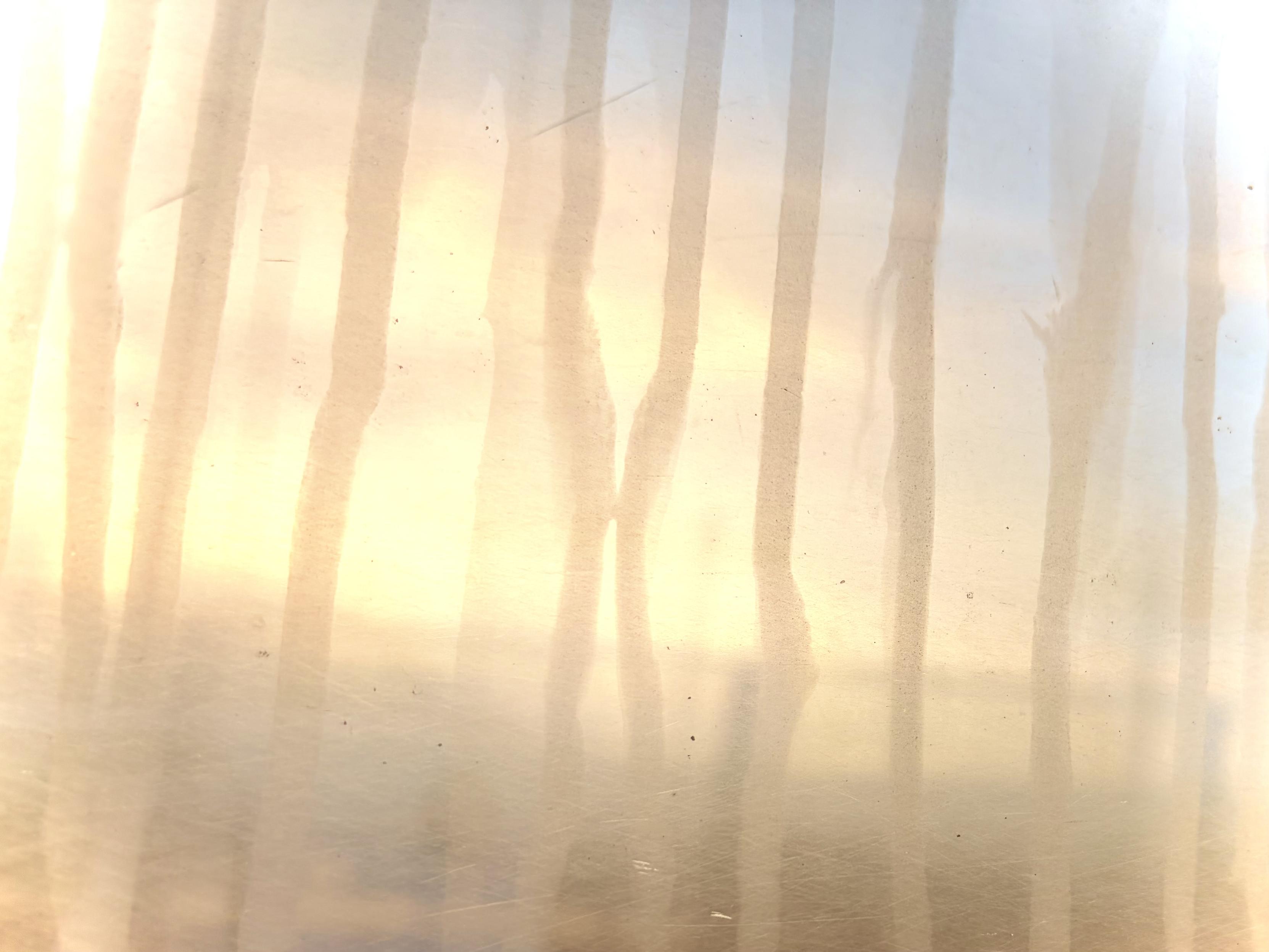Sunset through a dirty train window