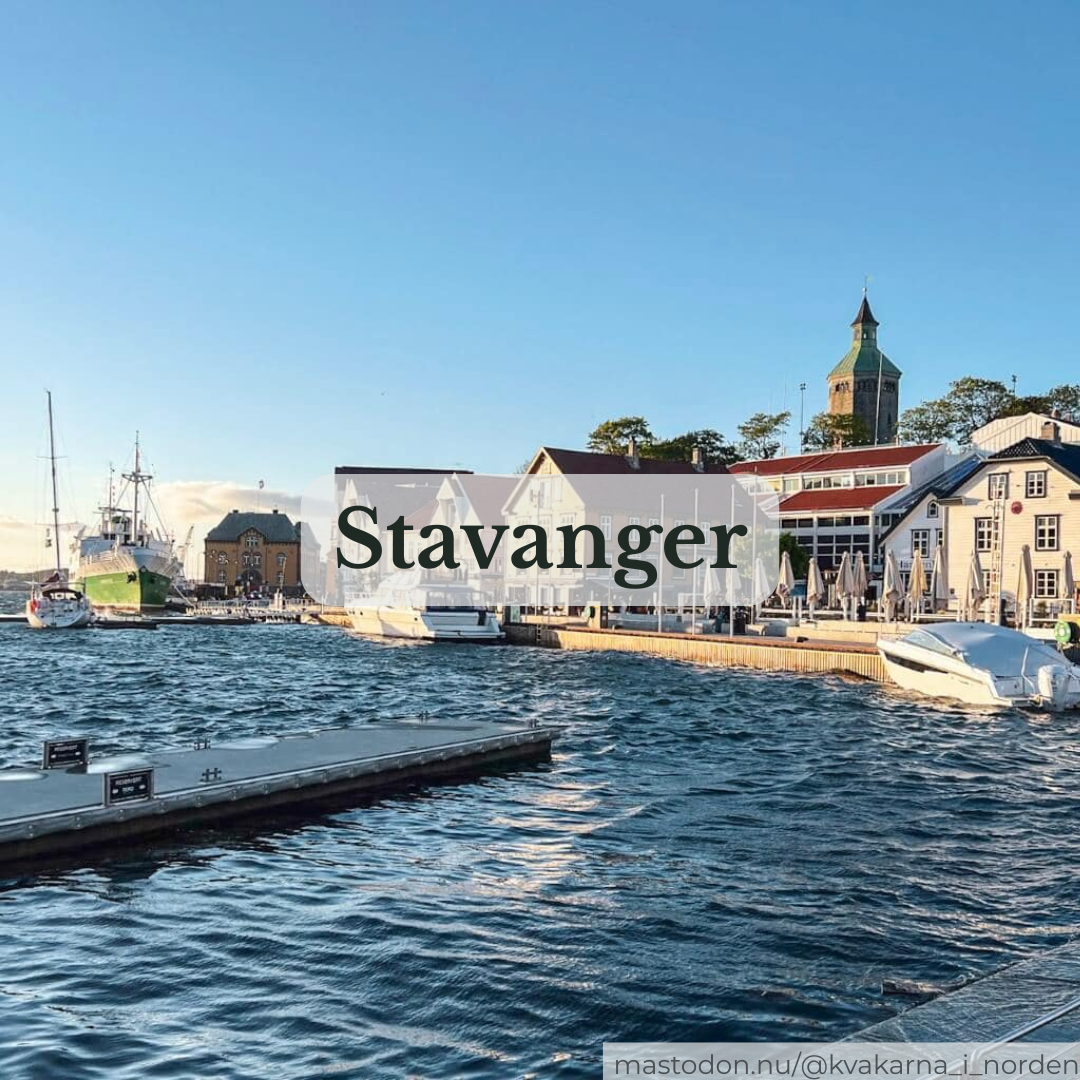 Harbor view in Stavanger featuring choppy water, boats, and white wooden waterfront buildings, with a central text overlay reading "Stavanger."