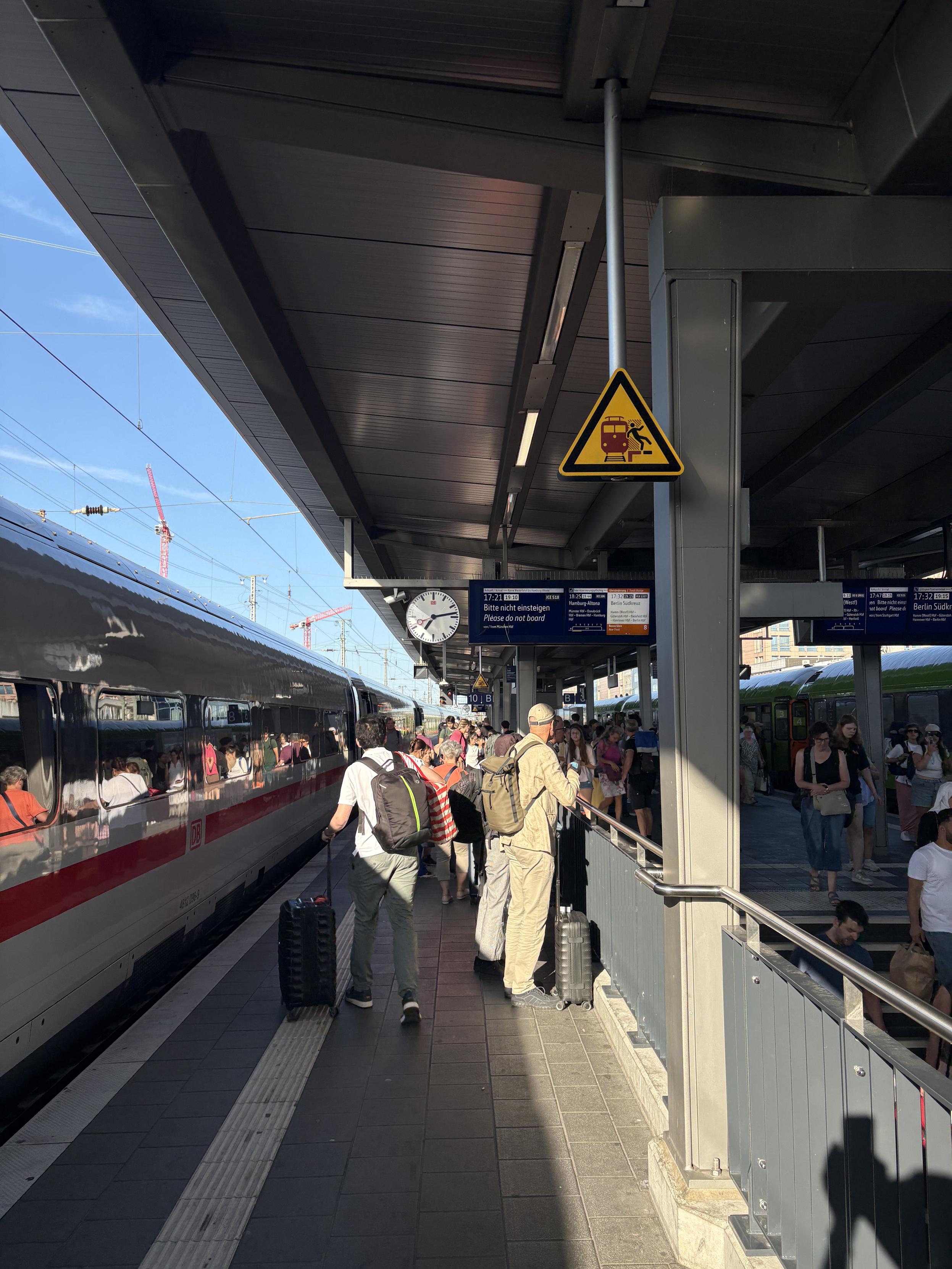 Train platform in Dortmund. Busy. A cancelled train.