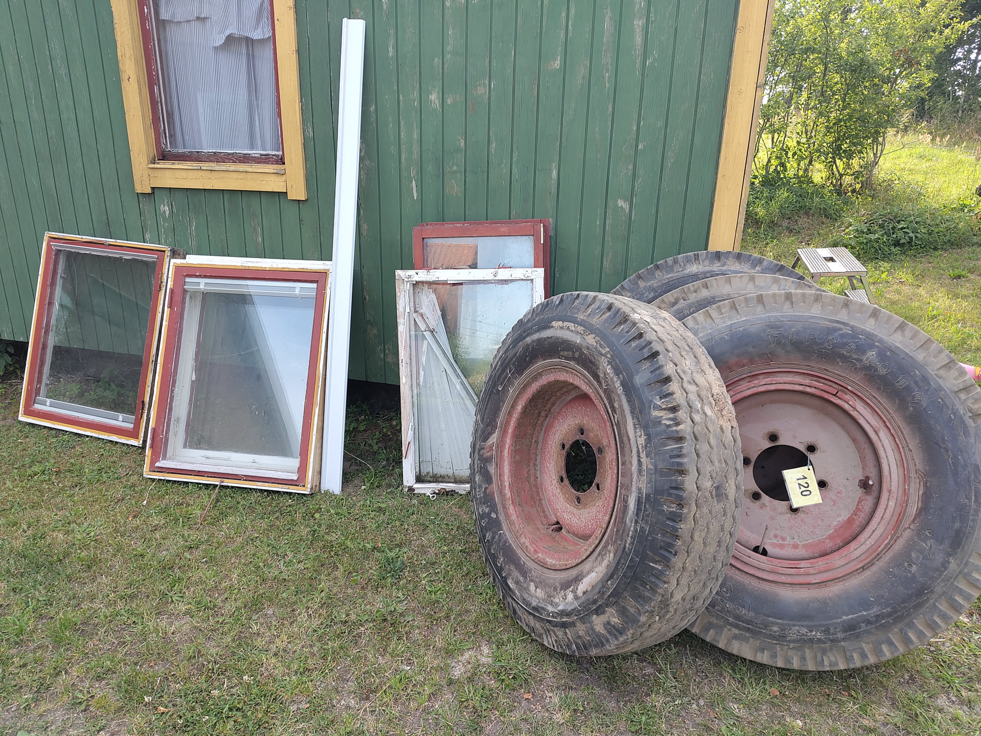 Second hand findings of the day: three windows complete with frames and four truck wheels (rims and tires).