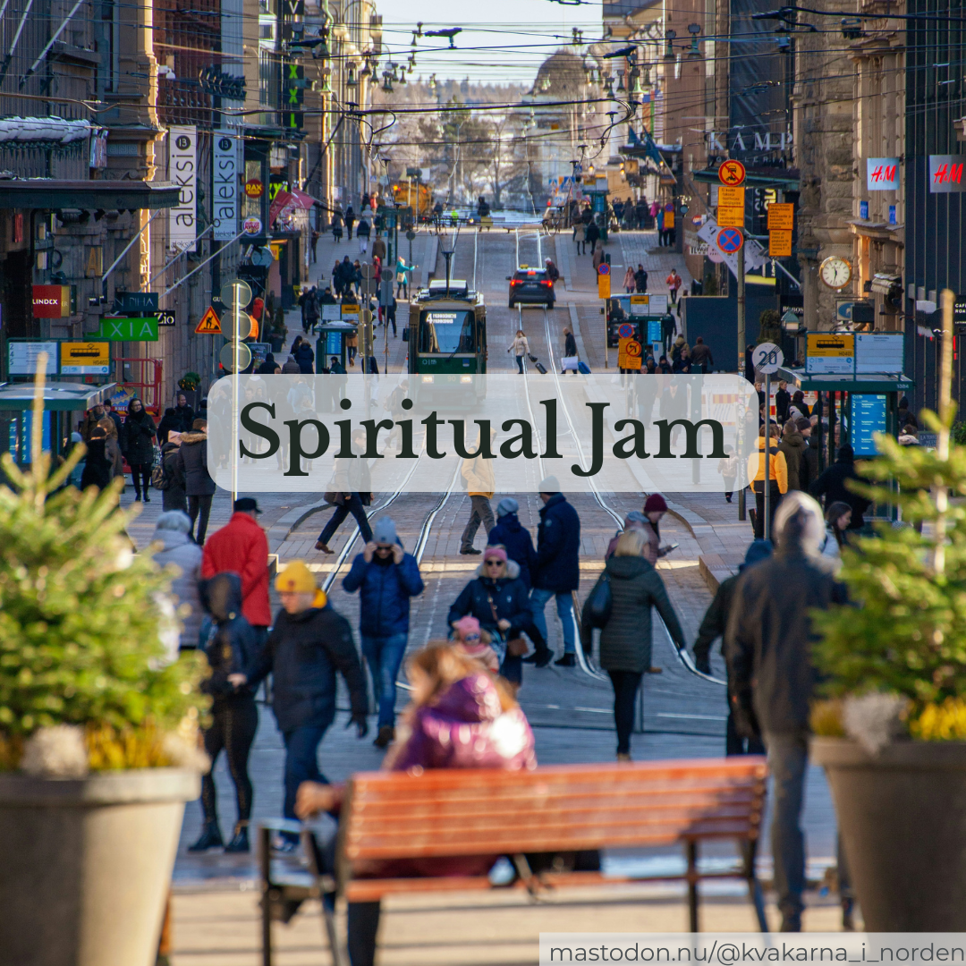 ​A busy European city street filled with pedestrians, tram tracks, and storefronts, overlaid with a semi-transparent white box containing the text "Spiritual Jam".